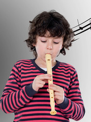 Cute child with pink jersey playing a flute © Gelpi