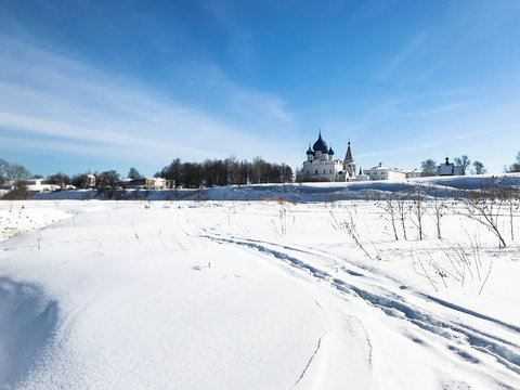 frozen river and Suzdal Kremlin in winter