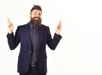 Bearded businessman with his fingers crossing