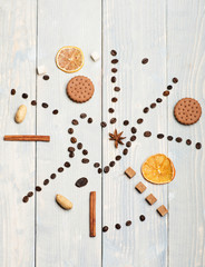Pattern made of coffee beans, cookies, dry orange and anise
