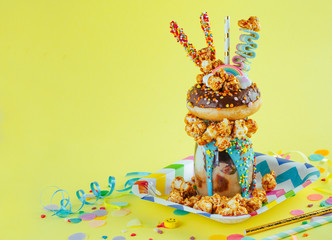 Freak shake on the yellow background with blank space for text