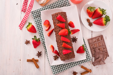 Chocolate roll with strawberries. 