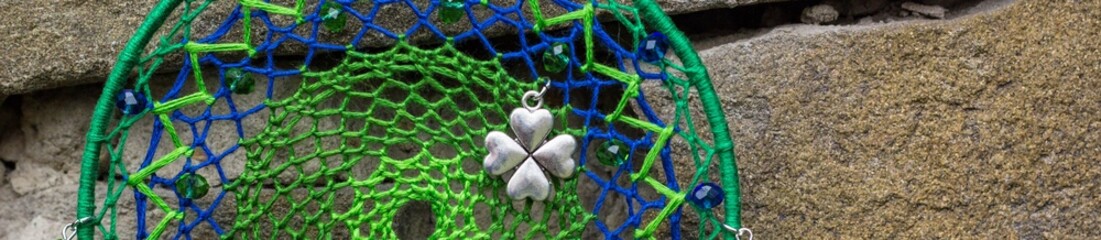 Banner of Handmade dream catcher with feathers threads and beads rope hanging
