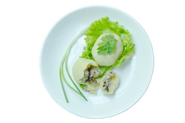 mashed steamed potato stuffed fried minced pork and mushroom on white plate