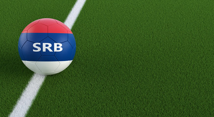 Soccer ball in Serbian national colors on a soccer field. Copy space on the right side - 3D Rendering 