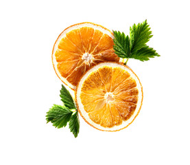 Dried orange round slices with green leaves on an isolated white background.