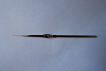 One thin (diameter 0.5 mm) steel crochet hook