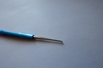 Steel 1.25 mm crochet hook with blue handle