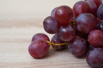 Fresh grape  on wooden table,fresh grape,delicious grape
