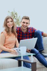 modern young people using laptop at home.