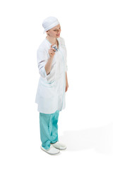 Beautiful young woman in white coat posing at studio. Full length studio shot isolated on white.