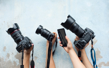 Technology of camera,Development of camera,various camera on the blue wall,Hold hands with favorite camera