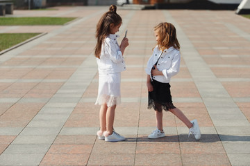 stylish funny little girls on the street