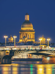 Fototapeta na wymiar Blagoveschensky or Annunciation Bridge and Saint Isaac Cathedral at night. Saint-Petersburg, Russia