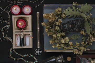 Occult altar with Pan's face, wreath of hops 