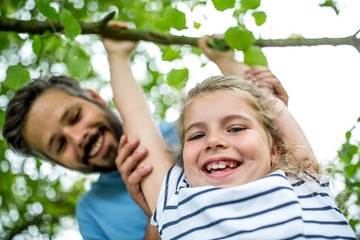 Girl plays and has fun with father