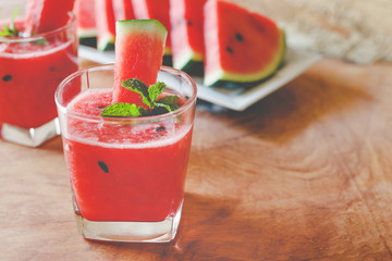 Watermelon drink on wooden background.