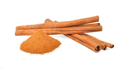 Cinnamon sticks and powder on white background