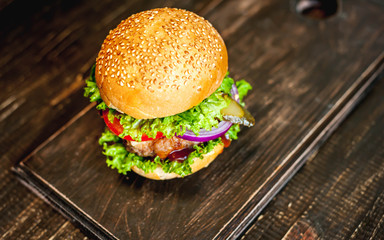Delicious fresh homemade burger on a wooden table