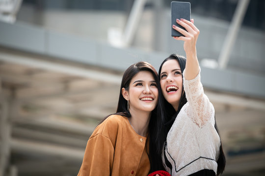 woman and friend taking selfie