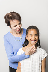 Fototapeta premium black girl child with grandmother in studio white background
