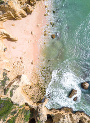 Aerial view of sandy beach and ocean with beautiful clear turquoise water. 