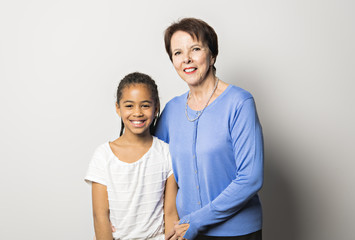 black girl child with grandmother in studio white background