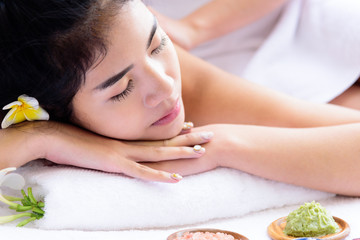 Plakat Portrait of beautiful asian people with close up view and close up eyes and having hand massage in spa salon. Beauty, healthy, spa and relaxation concept.