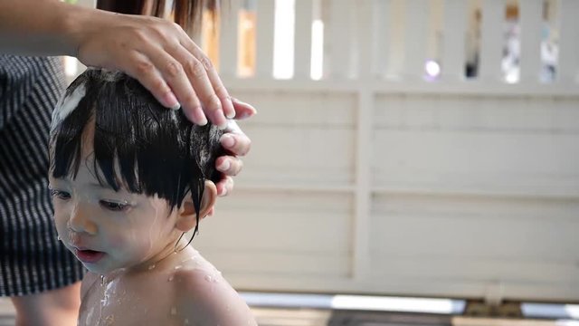 Mother Wash Hair Her Son With Shampoo, Happy Family