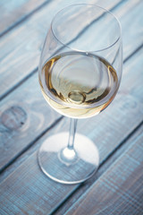 White wine on blue wood