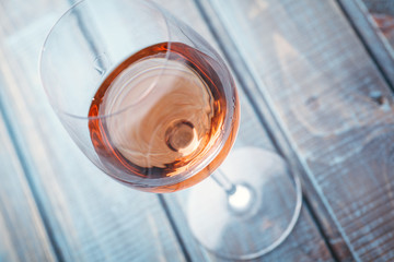 Rose wine on blue wood