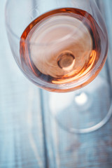 Rose wine on blue wood
