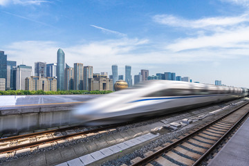 high speed train with panoramic cityscape