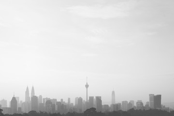 Fototapeta na wymiar beautiful and dramatic view of Kuala Lumpur Cityscape skyline and buildings silhouette in black and white image with large copy space.