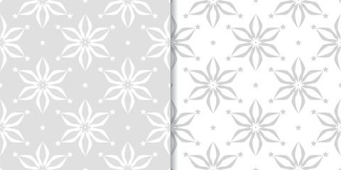 Light gray floral backgrounds. Set of seamless patterns