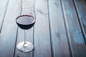 Red wine on blue wood