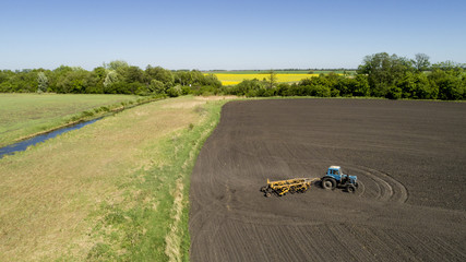 Aerial view of a tractor on a field
