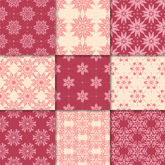 Cherry red and beige floral ornaments. Collection of seamless patterns