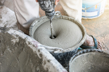 Fototapeta premium Cement or mortar is inside cement mixer in bucket. 