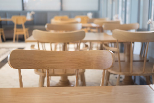 Wooden tables with chairs in a restaurant