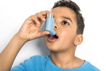 black Boy using an asthma inhaler
