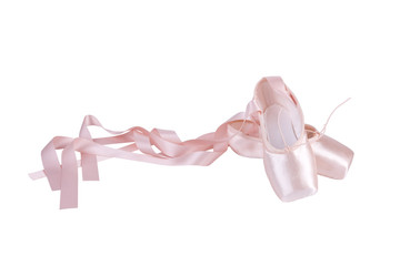 Pink ballet shoes isolated on a white background