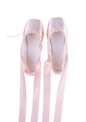 Top view of pink ballet shoes isolated on a white background