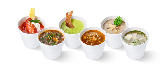 Obraz na płótnie Canvas Set of various restaurant soups, isolated on white