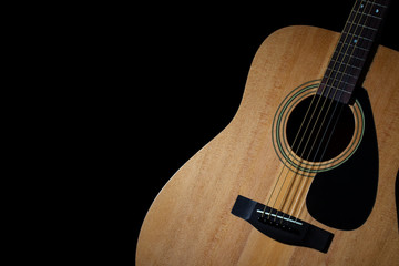 Modern acoustic guitar on black background