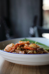 Pad thai with shrimp . Thai food on wood background