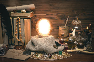 Crystal ball and tarot cards on fortune teller desk. Future reading concept. Paranormal magic table.