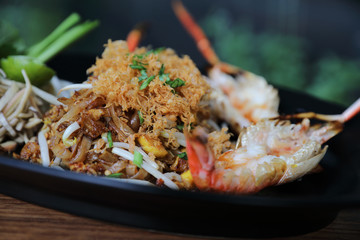 Shrimp pad thai noodles with shrimps on top , Thai food