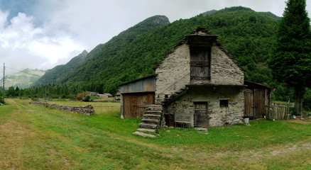 Fototapeta na wymiar Valle Versasca; rural scene on a valley floor in Italian Switzerland