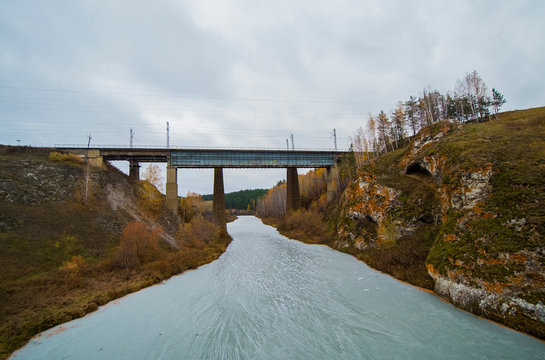 Landscape with railway bridge over frozen river, Kislokan, Evenk, Russia